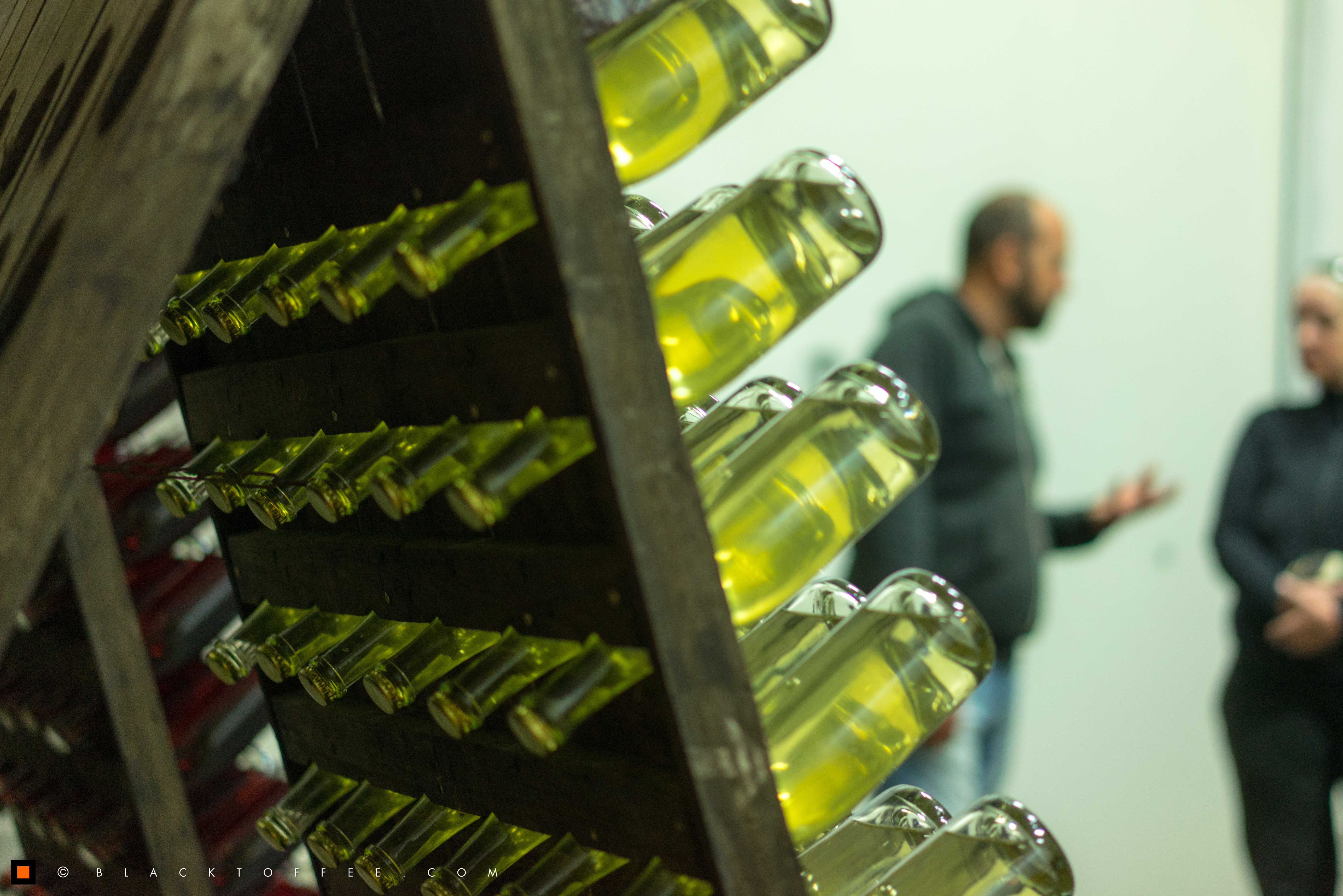 Empty wine bottles stacked upside down